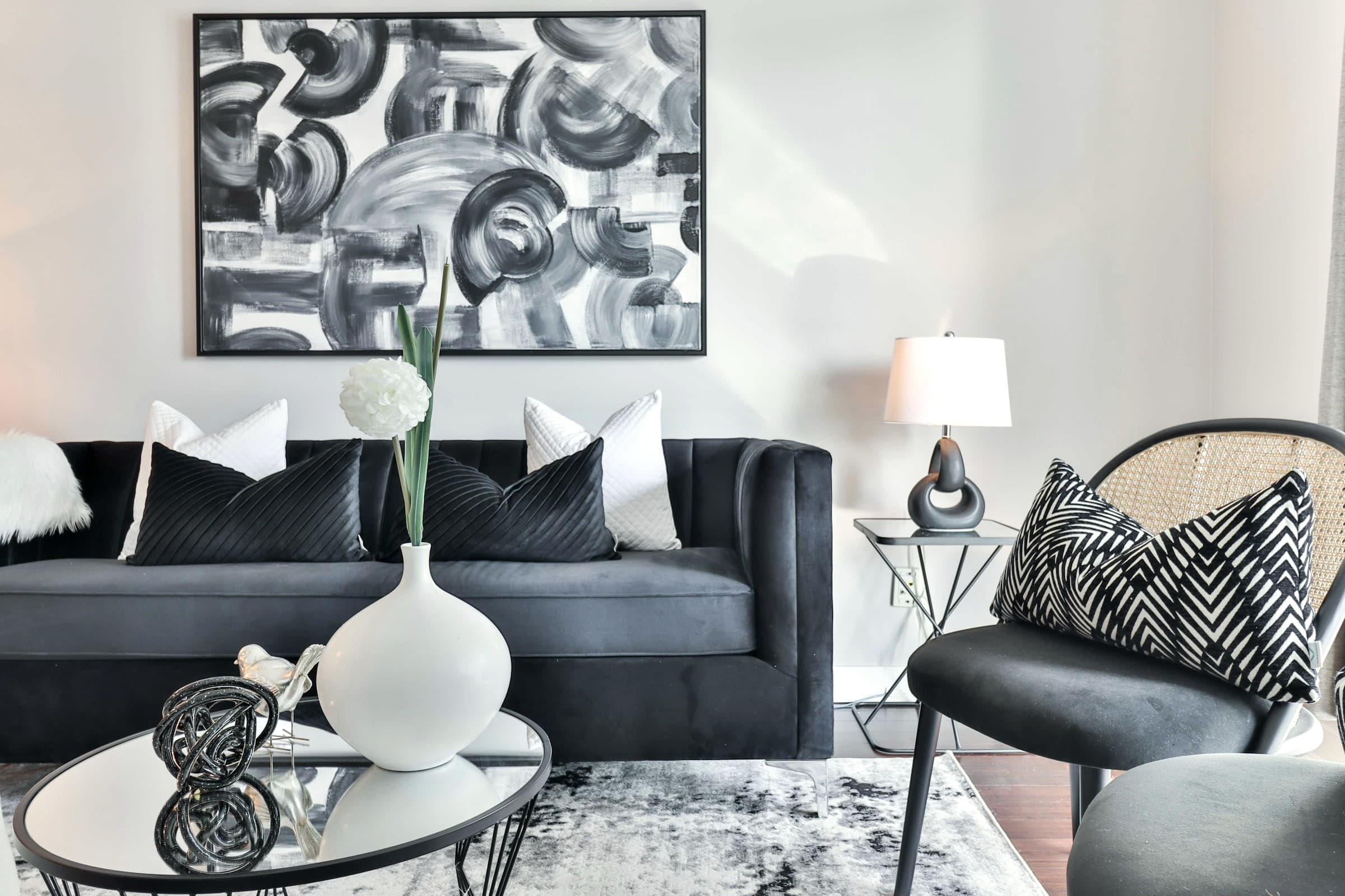 Charcoal upholstered seating with graphic monochrome artwork